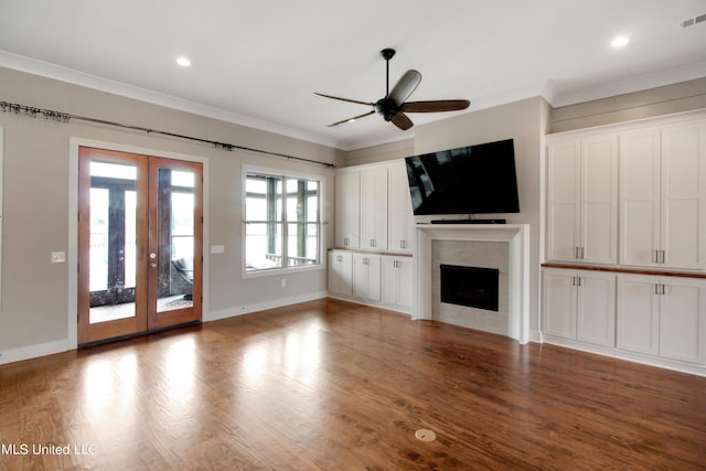 119 Shore View Dr, Madison, MS 39110 - unfurnished living room with french doors, a ceiling fan, a fireplace, wood finished floors, and crown molding
