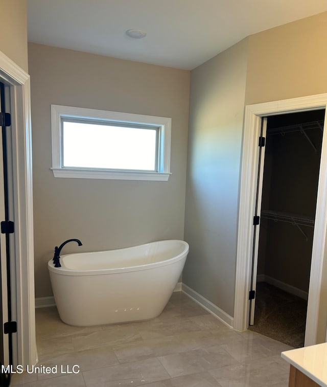 bathroom featuring a bath and vanity