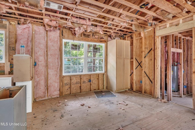 839 Herrin Dr, Picayune, MS 39466 - misc room with healthy amount of natural light and gas water heater