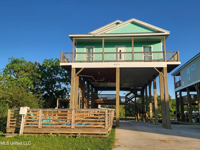 4024 Honshu St, Bay Saint Louis, MS 39520 - view of property's community with a carport, stairway, and driveway