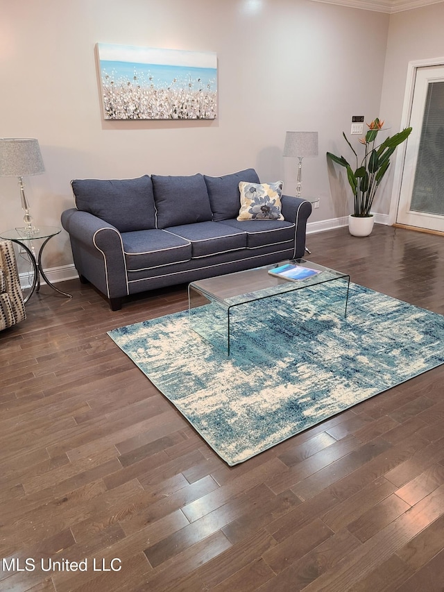 4024 Honshu St, Bay Saint Louis, MS 39520 - living area featuring crown molding, baseboards, and wood finished floors