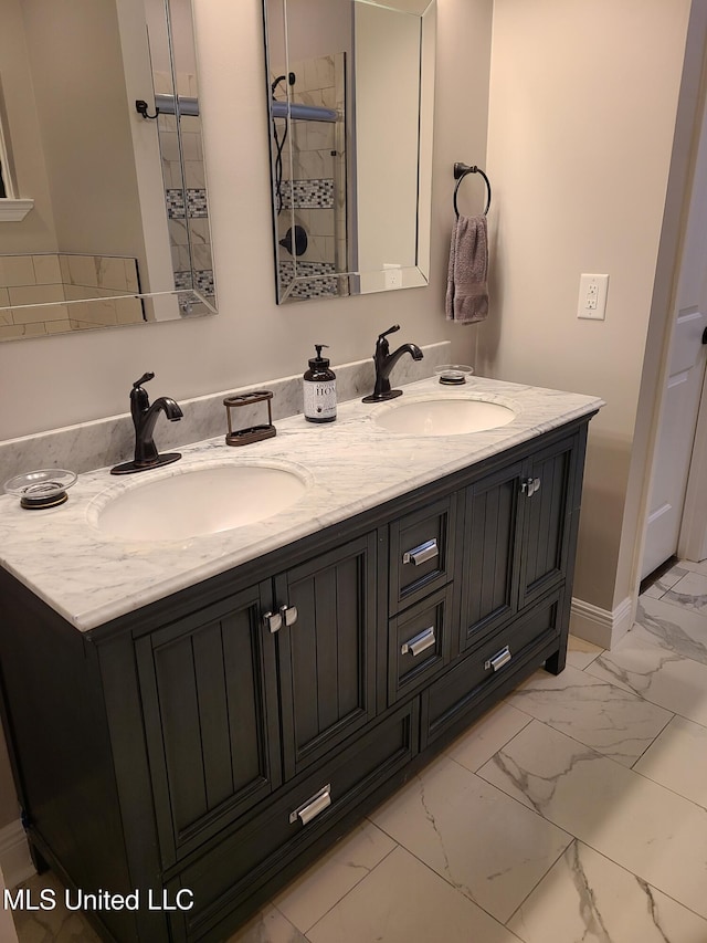4024 Honshu St, Bay Saint Louis, MS 39520 - full bath with double vanity, marble finish floor, a sink, and baseboards