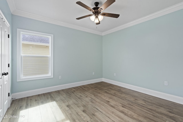 empty room with ceiling fan, light hardwood / wood-style floors, and crown molding