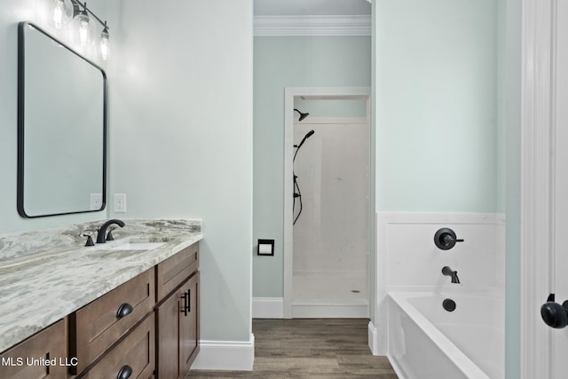 bathroom featuring hardwood / wood-style flooring, vanity, separate shower and tub, and crown molding