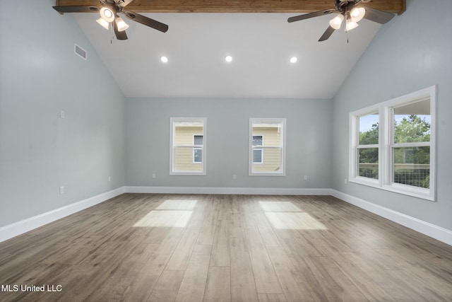 unfurnished room featuring hardwood / wood-style floors, ceiling fan, and high vaulted ceiling