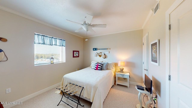 bedroom with crown molding, light colored carpet, and ceiling fan