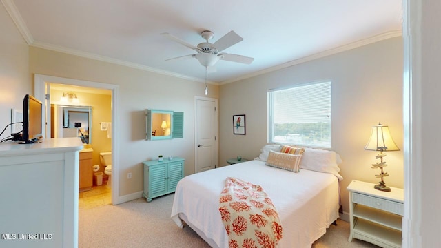 bedroom with ceiling fan, ornamental molding, ensuite bathroom, and light carpet