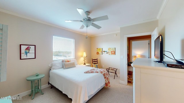 carpeted bedroom featuring ornamental molding and ceiling fan