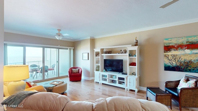 living room featuring crown molding, ceiling fan, and light wood-type flooring