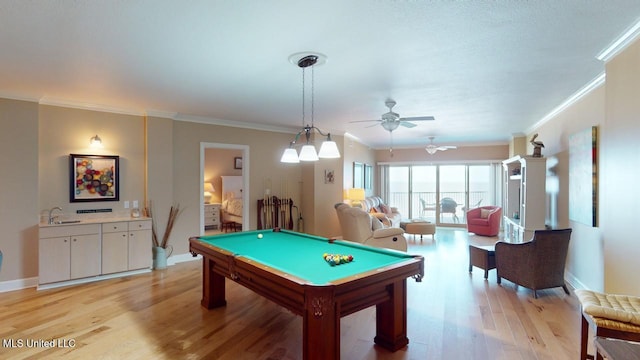 game room featuring sink, light hardwood / wood-style flooring, ceiling fan, ornamental molding, and pool table