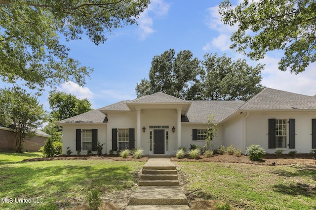 119 Middle Field Dr, Canton, MS 39046 - view of front of home with a front yard, a shingled roof, and stucco siding