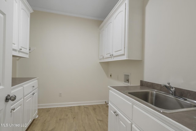 119 Middle Field Dr, Canton, MS 39046 - clothes washing area featuring cabinet space, hookup for a washing machine, light wood-style flooring, baseboards, and ornamental molding