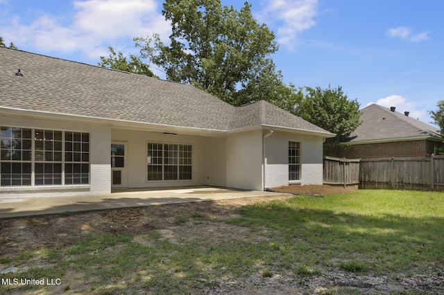 119 Middle Field Dr, Canton, MS 39046 - rear view of property with a shingled roof, a patio area, and brick siding