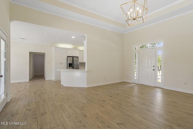 119 Middle Field Dr, Canton, MS 39046 - entrance foyer featuring light wood-type flooring, a chandelier, baseboards, ornamental molding, and recessed lighting