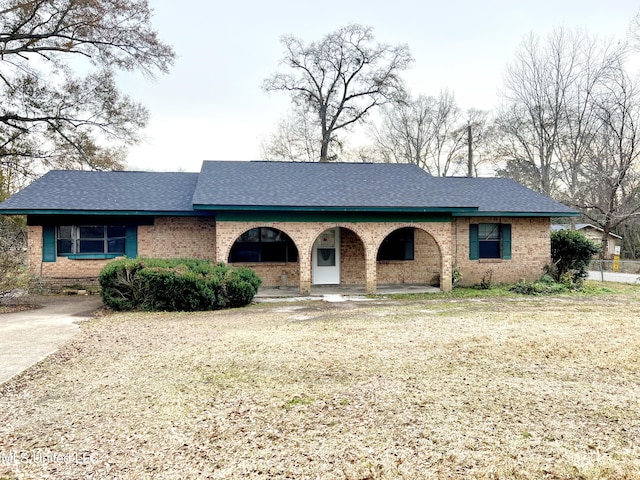 ranch-style house with a front lawn