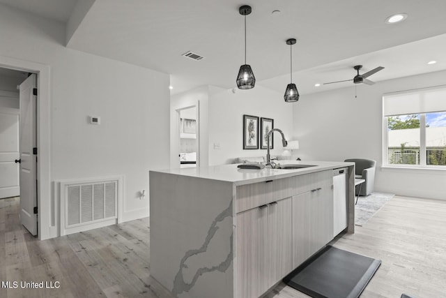 1302 Magnolia St Unit 109, Gulfport, MS 39501 - kitchen with a sink, light wood-type flooring, visible vents, recessed lighting, and stainless steel dishwasher
