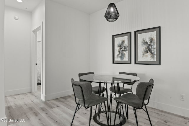 dining space featuring light wood-type flooring