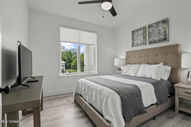 bedroom with light wood-type flooring and ceiling fan