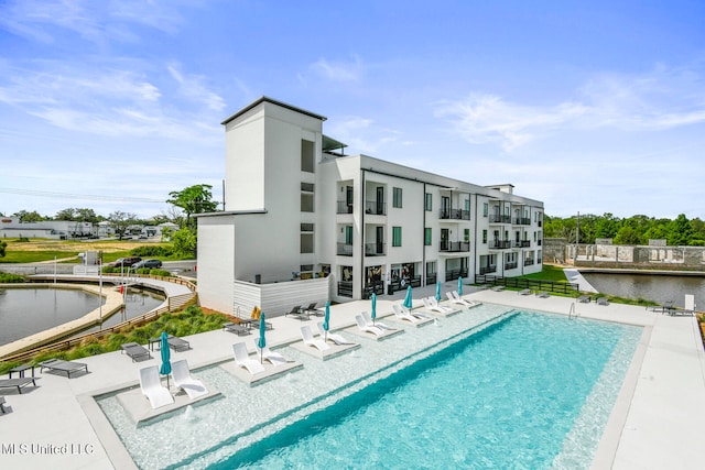 view of swimming pool with a patio