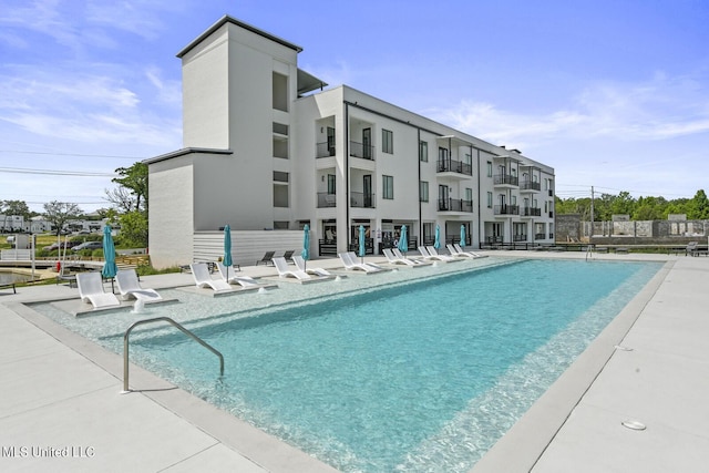 1302 Magnolia St Unit 109, Gulfport, MS 39501 - community pool with a patio area and fence