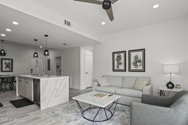 1302 Magnolia St Unit 109, Gulfport, MS 39501 - living area featuring ceiling fan, light wood-style flooring, visible vents, and recessed lighting