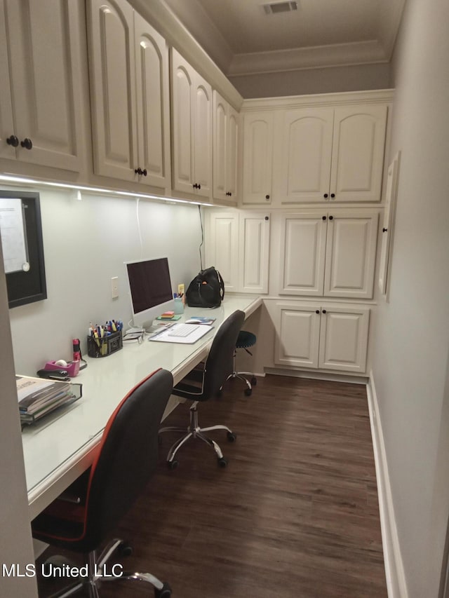 office with dark wood-type flooring and crown molding