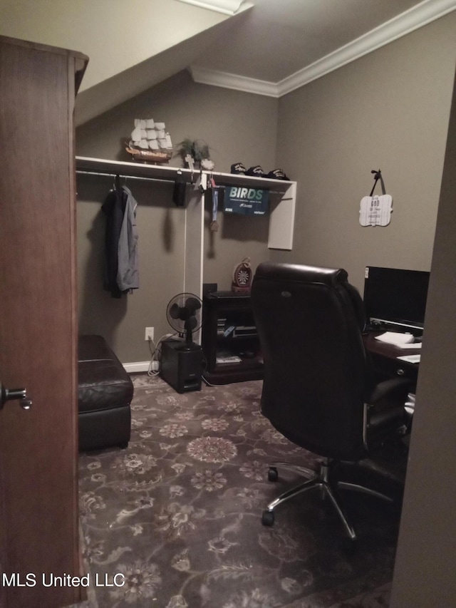 carpeted home office featuring crown molding