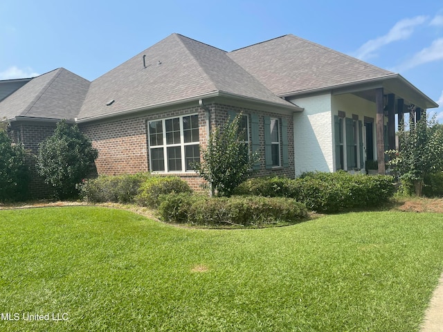 view of property exterior featuring a lawn