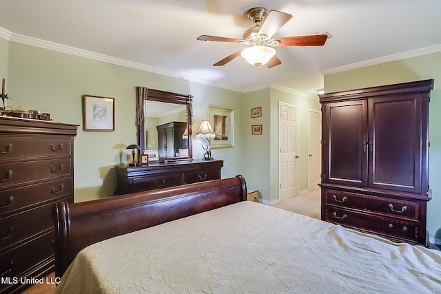 bedroom featuring ornamental molding, light colored carpet, and ceiling fan