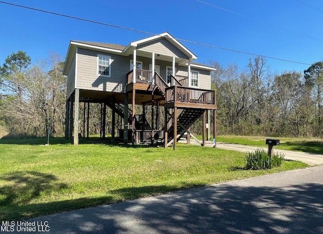 6102 Lepoma Ave, Biloxi, MS 39532 - beach home featuring stairs, covered porch, a front lawn, and driveway