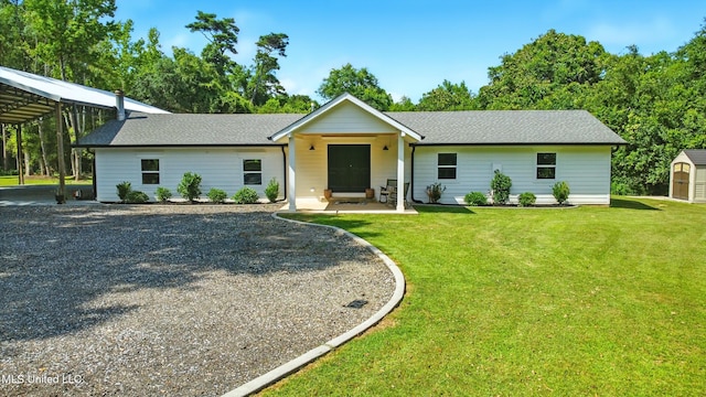280 Bobby Ln, Picayune, MS 39466 - single story home with a front lawn, roof with shingles, a carport, and gravel driveway