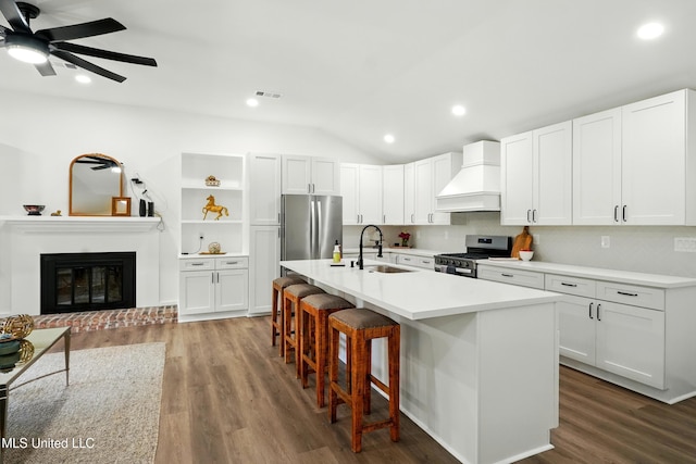 280 Bobby Ln, Picayune, MS 39466 - kitchen with custom range hood, appliances with stainless steel finishes, a sink, vaulted ceiling, and open shelves
