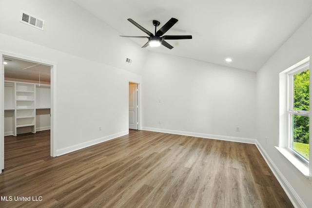 280 Bobby Ln, Picayune, MS 39466 - unfurnished bedroom with multiple windows, wood finished floors, a walk in closet, attic access, and high vaulted ceiling