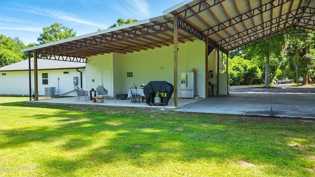 280 Bobby Ln, Picayune, MS 39466 - rear view of property with a lawn, a carport, a patio area, and central AC
