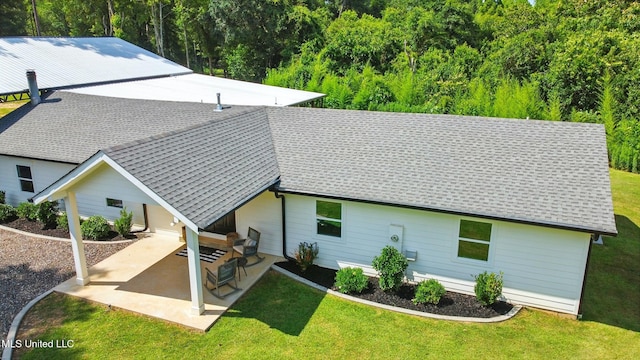 280 Bobby Ln, Picayune, MS 39466 - back of property featuring a shingled roof, a yard, and a patio