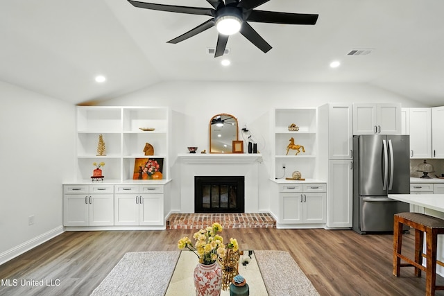 280 Bobby Ln, Picayune, MS 39466 - living room featuring lofted ceiling, ceiling fan, light wood finished floors, a fireplace, and baseboards