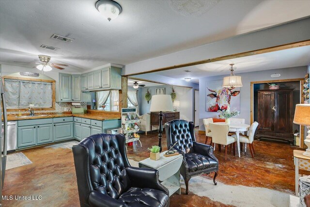 1563 Dry Creek Rd, Magee, MS 39111 - living area with a ceiling fan and finished concrete flooring
