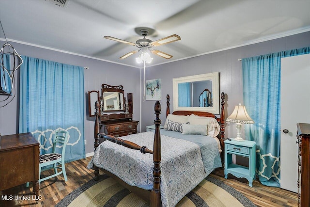 1563 Dry Creek Rd, Magee, MS 39111 - bedroom with wood finished floors, crown molding, and ceiling fan