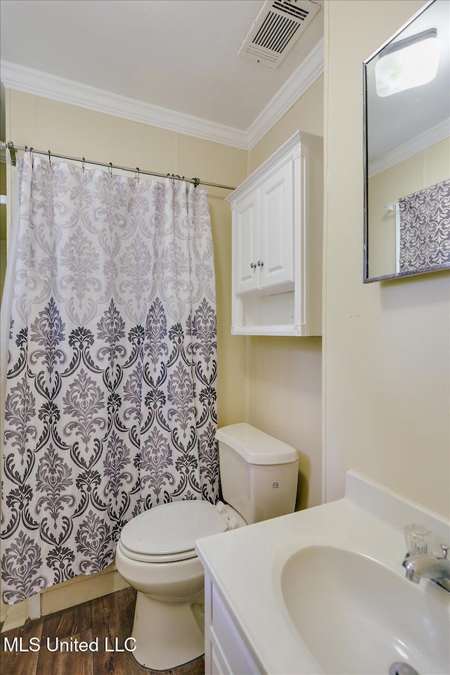 1563 Dry Creek Rd, Magee, MS 39111 - bathroom with toilet, crown molding, wood finished floors, vanity, and a shower with shower curtain