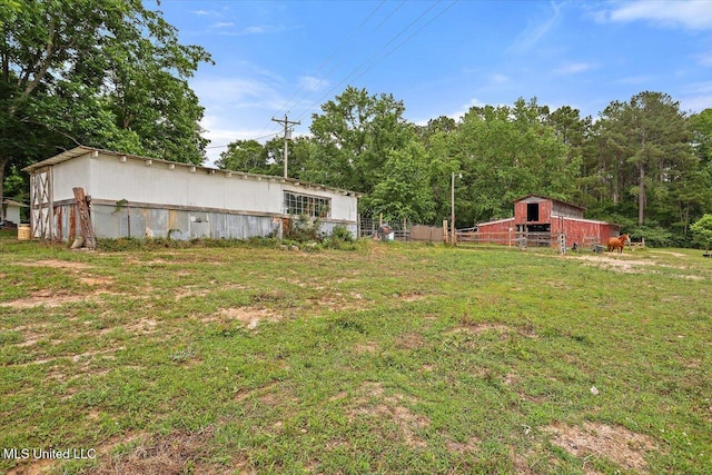 1563 Dry Creek Rd, Magee, MS 39111 - view of green lawn featuring a barn and an outdoor structure