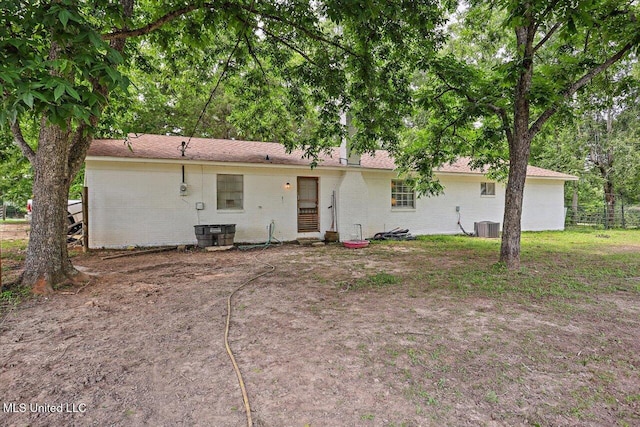 1563 Dry Creek Rd, Magee, MS 39111 - back of house featuring brick siding and central air condition unit
