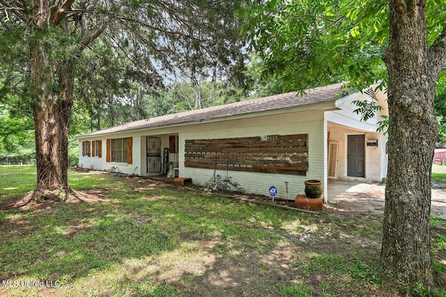 1563 Dry Creek Rd, Magee, MS 39111 - ranch-style home with brick siding and a carport