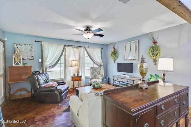 1563 Dry Creek Rd, Magee, MS 39111 - living room with ceiling fan, finished concrete flooring, and baseboards