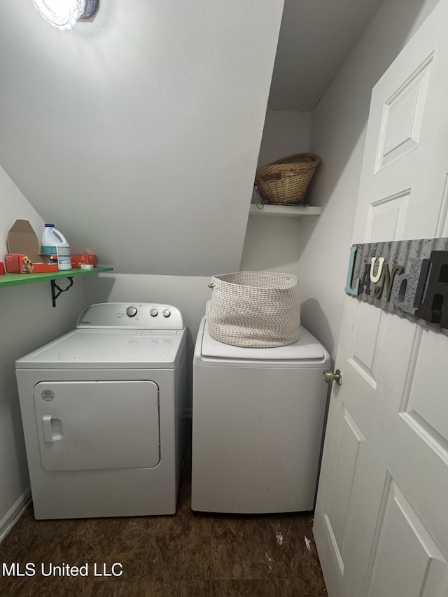 clothes washing area with separate washer and dryer