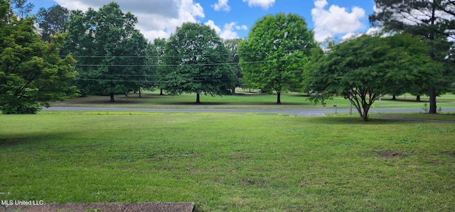 surrounding community featuring a lawn