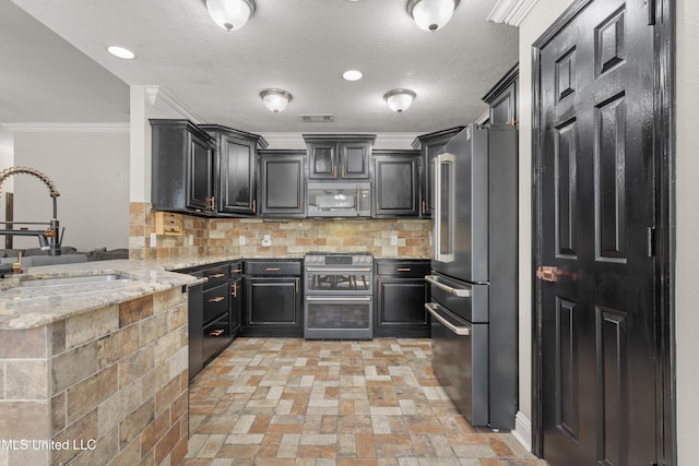 kitchen featuring sink, crown molding, decorative backsplash, light stone counters, and stainless steel appliances