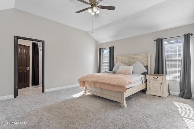 carpeted bedroom with ceiling fan and lofted ceiling