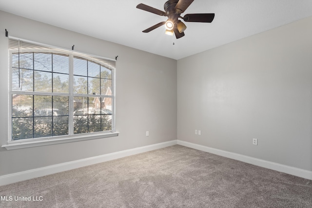 empty room with carpet and ceiling fan