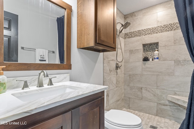 bathroom with a shower with curtain, vanity, and toilet