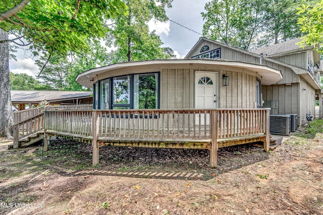 363 Lake Harbor Rd, Brandon, MS 39047 - view of front of house with roof with shingles, a wooden deck, and central AC unit